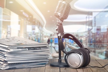 News and microphone on table.