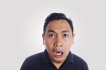 Obraz premium Funny Asian Man Close Up Shocked Face