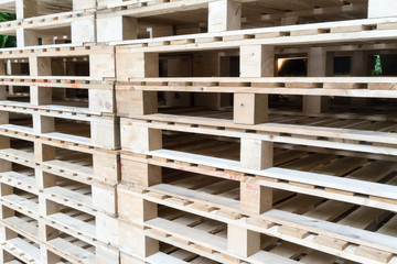 Stack of wooden pallets in factory warehouse