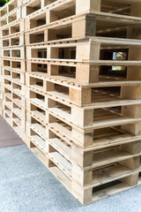 Stack of wooden pallets in factory warehouse