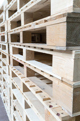 Stack of wooden pallets in factory warehouse