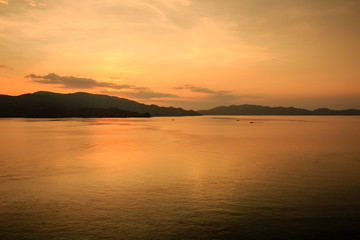 Fototapeta premium Sunset over the ocean in the Komodo national park, Indonesia