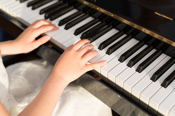 girl playing piano