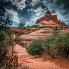 Hiking trail to Bell Rock with dramatic clouds and sky