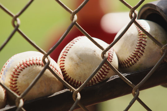 Baseballs lined up in a holder