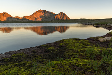 Obraz premium Amazing red Sunset landscape of Tevno lake, Pirin Mountain, Bulgaria