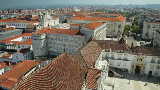 Coimbra uptown aerial view from top of bell clock tower. Coimbra University courtyard and Mondego river on background. Coimbra in Central Portugal, is famous for its University, the oldest in Europe.