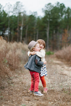 Stylish and cute young childen having fun outside