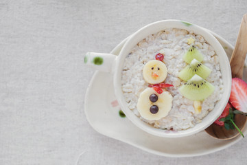 snowman and christmas tree oatmeal porridge breakfast, fun Christmas food art for kids, vegan planted base diet