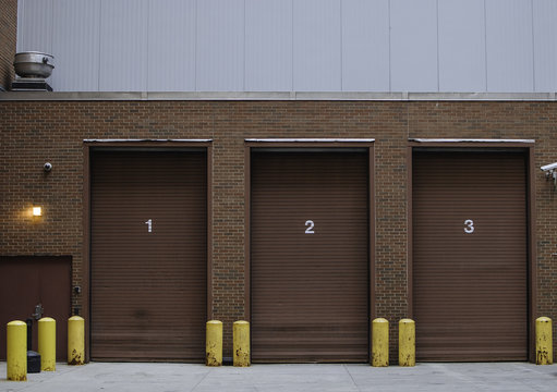 three numbered garage doors