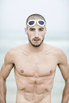 Portrait of young handsome swimmer