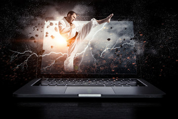 Man in kimono and glowing laptop. Mixed media