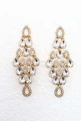 Grape chandelier Dangle cluster shape of many diamond set Earring, three set of tear drop design on isolated background, studio lighting