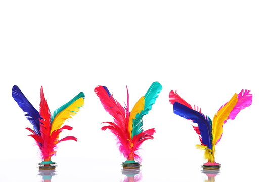 Colorful feather Shuttlecock in red, pink, yellow, green, blue, purple, over white background