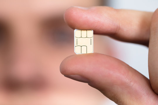 Man Holding Nano Sim Card