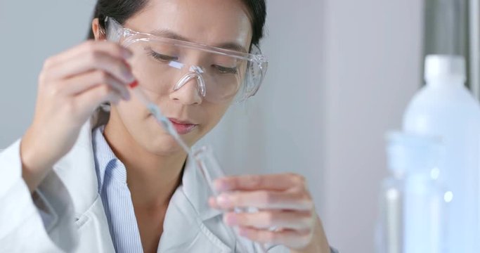 Serious scientist is doing her research