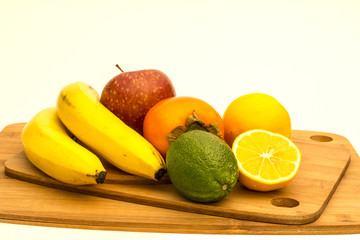 Tropical fruits on cutting board