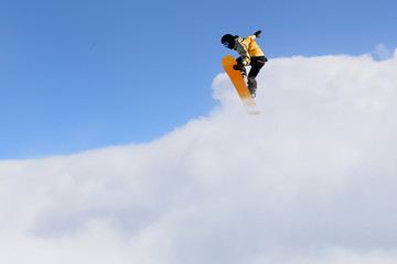 Snowboarder making jump