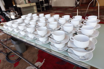 Group of empty coffee cups.Many rows of white cup for service tea or coffee in breakfast or buffet and seminar event. white cup in Catering and Cocktail.