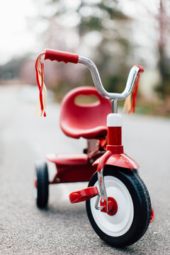 A tricycle parked in the middle of a street