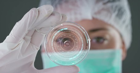 A futuristic doctor with syringe withdraws a liquid medicine and appears a hologram of a planet. Concept: medicine in the world, medical care, future, global competitor pharmaceutical companies. - Powered by Adobe