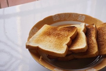Toaster Bread slices serve on chinese pattern plate for breakfast meal