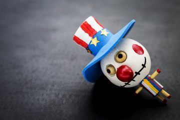 Bozo ghost wooden doll on black background, Halloween concept