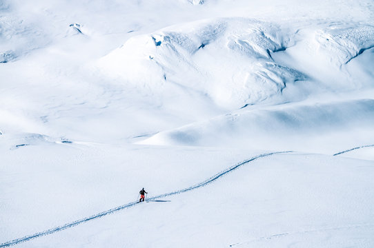ski tourer on big mountains in a winterlandscape
