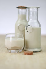 Milk in glass bottles, closeup, background