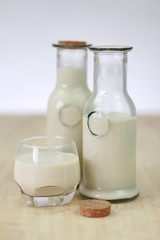 Milk in glass bottles, closeup, background
