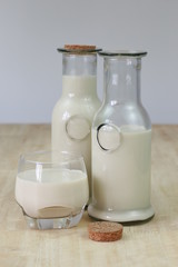 Milk in glass bottles, closeup, background