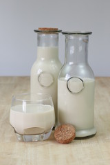 Milk in glass bottles, closeup, background