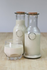 Milk in glass bottles, closeup, background