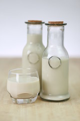 Milk in glass bottles, closeup, background