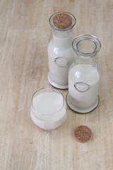 Milk in glass bottles, closeup, background