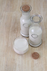 Milk in glass bottles, closeup, background