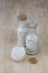 Milk in glass bottles, closeup, background