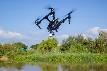 Fototapeta na wymiar Professional camera drone fast flying.