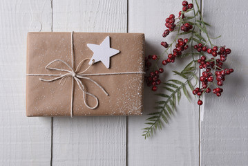 Plain wrapped Christmas present with a star gift tag