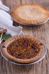 Apple and pecan pies on a wooden background - Traditional Thanksgiving desserts
