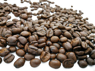 Pile of roasted coffee on white background