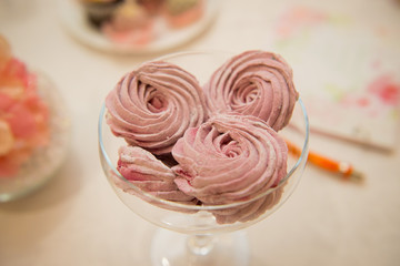 Cakes marshmallow pink in a glass vase