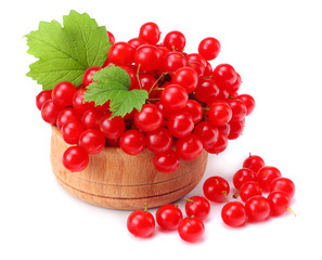 Red berries of Viburnum (arrow wood) in wooden bowl with green leaf isolated on white background