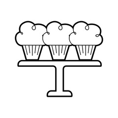 three birthday cupcakes arranged on a serving tray