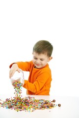 Little boy eating sweets