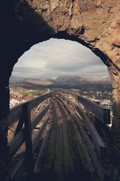 An archway on a castle wall in the small Andalusian town of Priego de Cordoba, Spain
