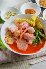 pink seafood flat noodle (Tom Yum Yen-Ta-Fo)