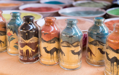 Sand pictures bottles for sale at bedouin market