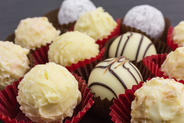 differently decorated white chocolate truffles