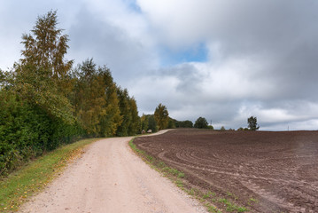 Gravel road in latvian countryside.